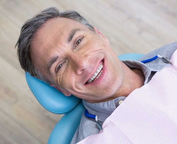 Man smiling during dental restoration process